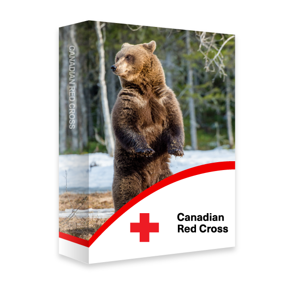 A Red Cross course book with image of a a large brown grizzly bear stands on it's hind legs in the wilderness.